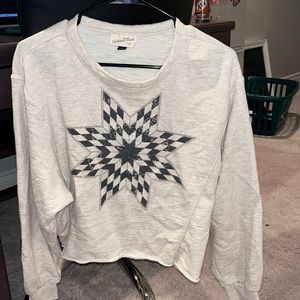 Cream Universal Thread cropped long sleeve top with star decal